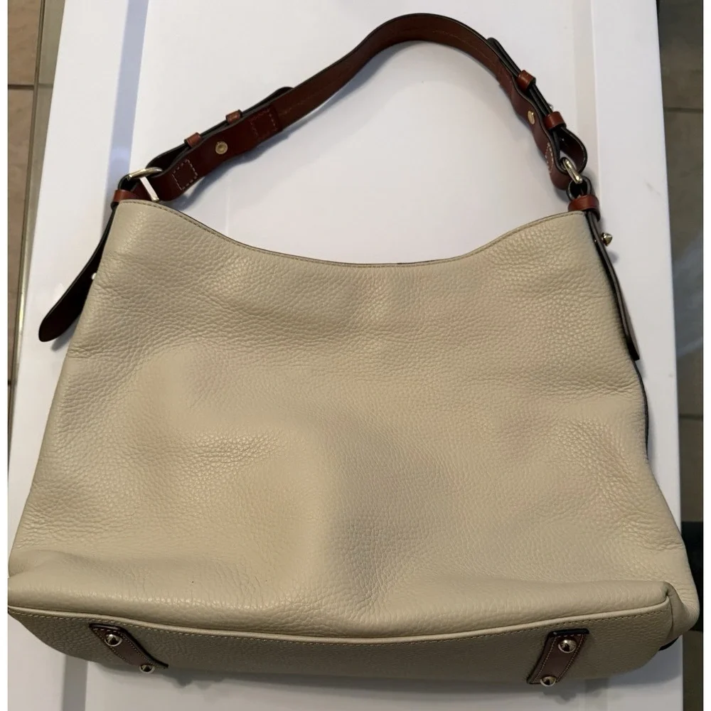 Dooney & Bourke Hobo Bag Women Large Cream Pebbled Leather Tan Trim Logo Plaque